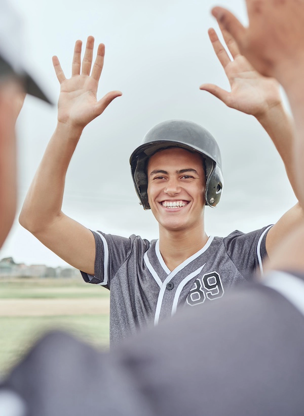 Boy celebrating a baseball game win